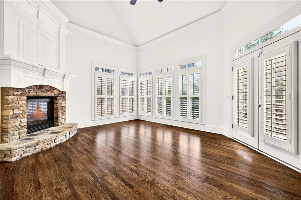 2910 Creek Tree Lane Cumming, GA 30041 - Photo 32 of 75 a view of a livingroom with wooden floor and fireplace