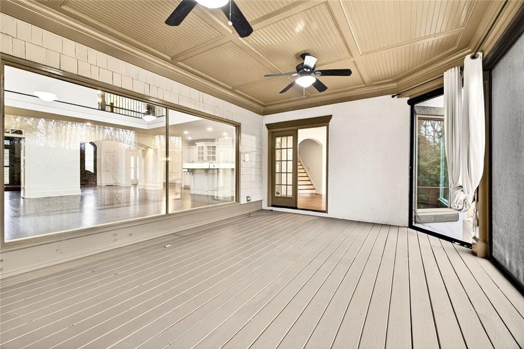 2910 Creek Tree Lane Cumming, GA 30041 - Photo 35 of 75 a view of an empty room with wooden floor and a window