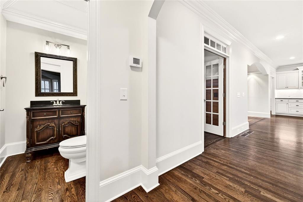 2910 Creek Tree Lane Cumming, GA 30041 - Photo 36 of 75 a view of a hallway with wooden floor and workspace