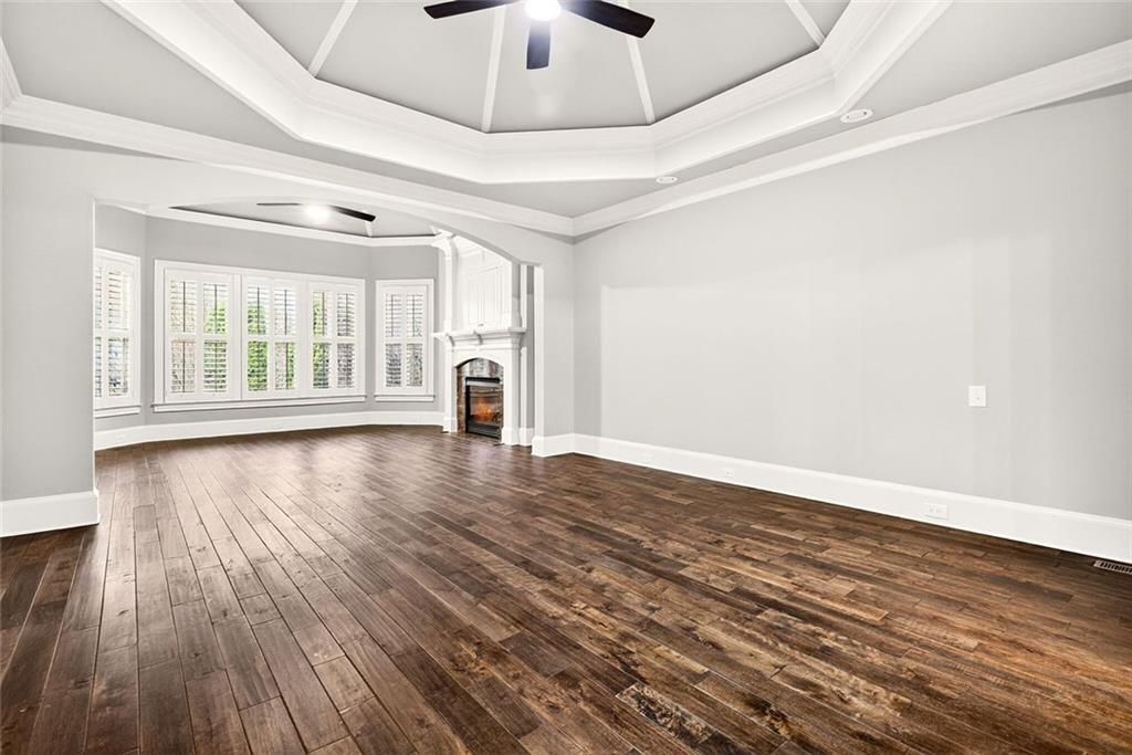 2910 Creek Tree Lane Cumming, GA 30041 - Photo 37 of 75 wooden floor in an empty room with a window