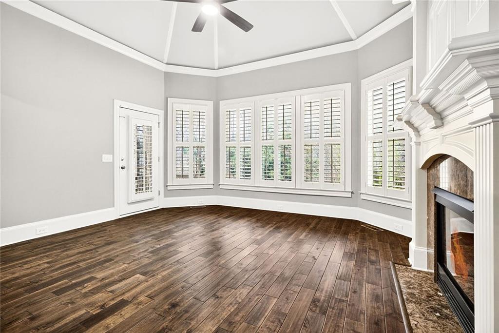 2910 Creek Tree Lane Cumming, GA 30041 - Photo 38 of 75 a view of an empty room with wooden floor and a window