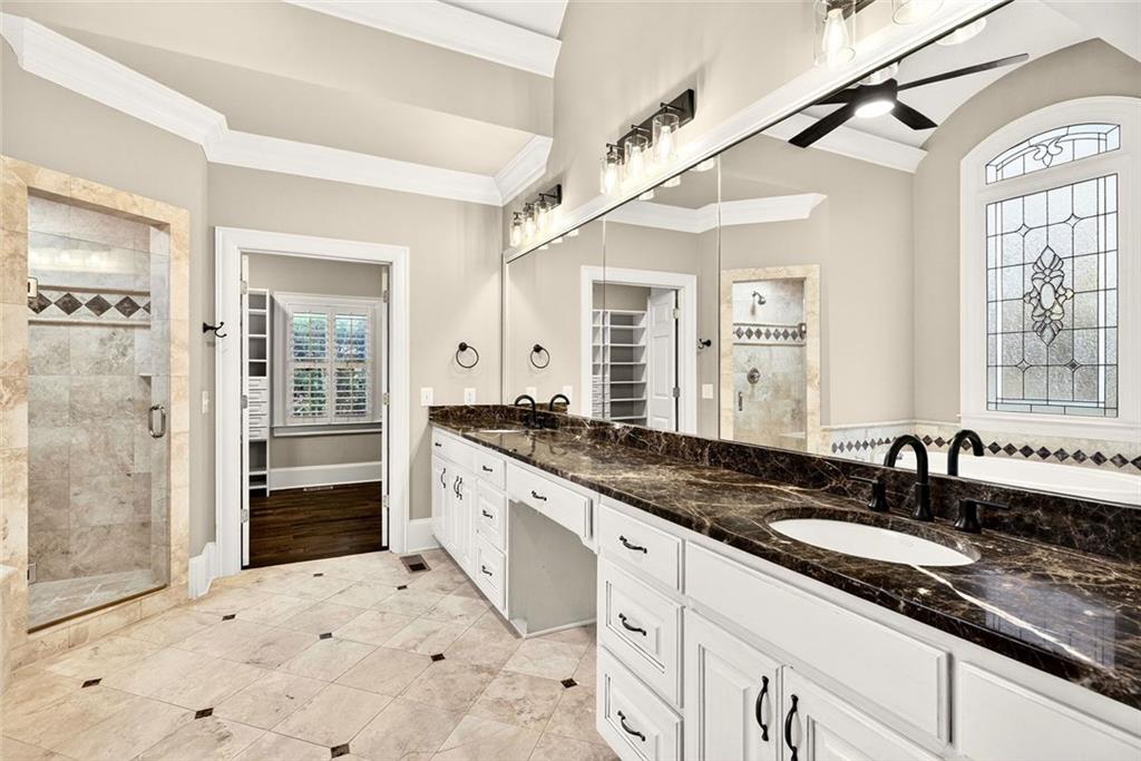 2910 Creek Tree Lane Cumming, GA 30041 - Photo 40 of 75 a spacious bathroom with a granite countertop sink mirror and double