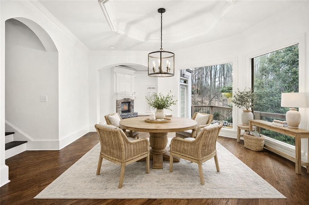 2910 Creek Tree Lane Cumming, GA 30041 - Photo 4 of 75 a view of a dining room with furniture window and wooden floor