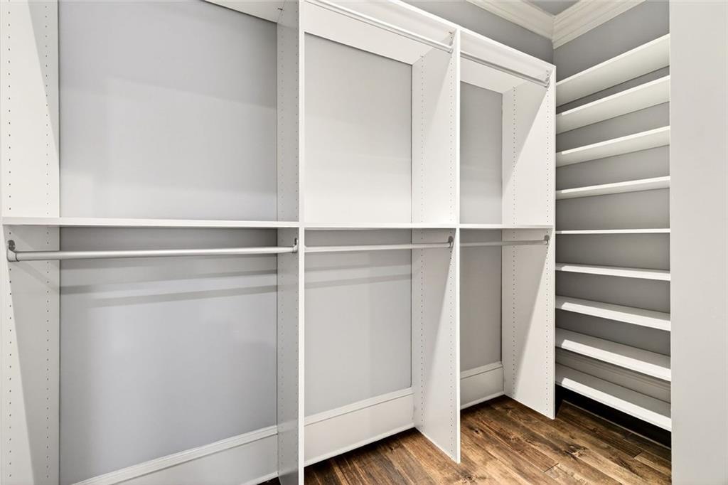 2910 Creek Tree Lane Cumming, GA 30041 - Photo 48 of 75 a view of walk in closet with empty racks