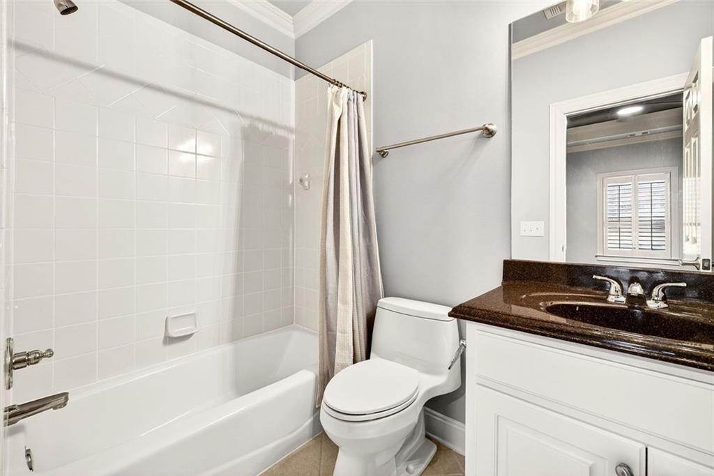 2910 Creek Tree Lane Cumming, GA 30041 - Photo 51 of 75 a bathroom with a sink toilet and shower