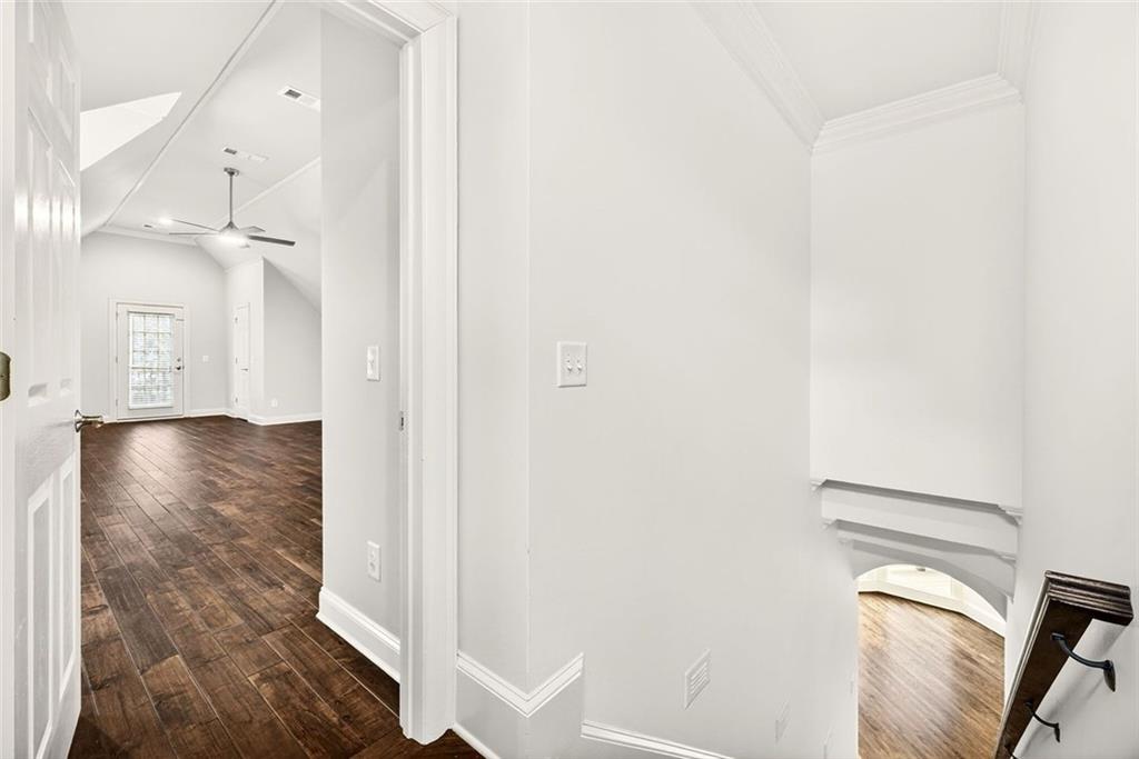 2910 Creek Tree Lane Cumming, GA 30041 - Photo 52 of 75 a view of a hallway with wooden floor
