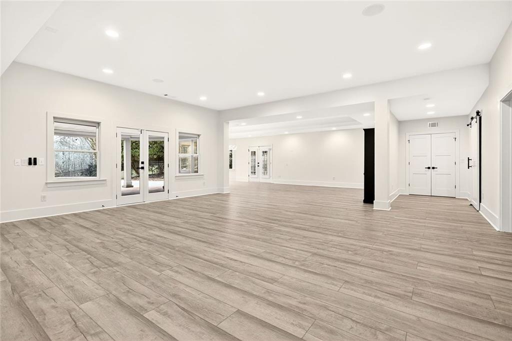 2910 Creek Tree Lane Cumming, GA 30041 - Photo 62 of 75 a view of a livingroom with wooden floor and a window