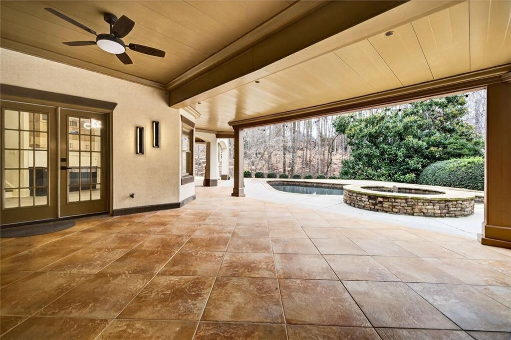 2910 Creek Tree Lane Cumming, GA 30041 - Photo 69 of 75 a view of an entryway with a floor to ceiling window and a ceiling fan