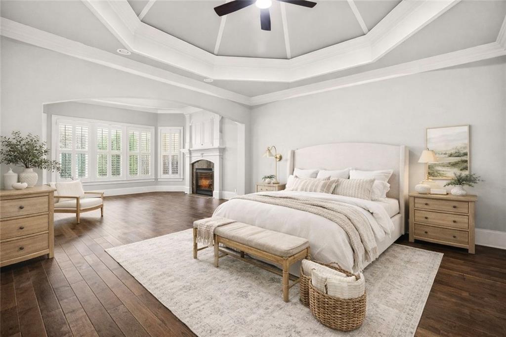 2910 Creek Tree Lane Cumming, GA 30041 - Photo 7 of 75 a spacious bedroom with a bed and wooden floor