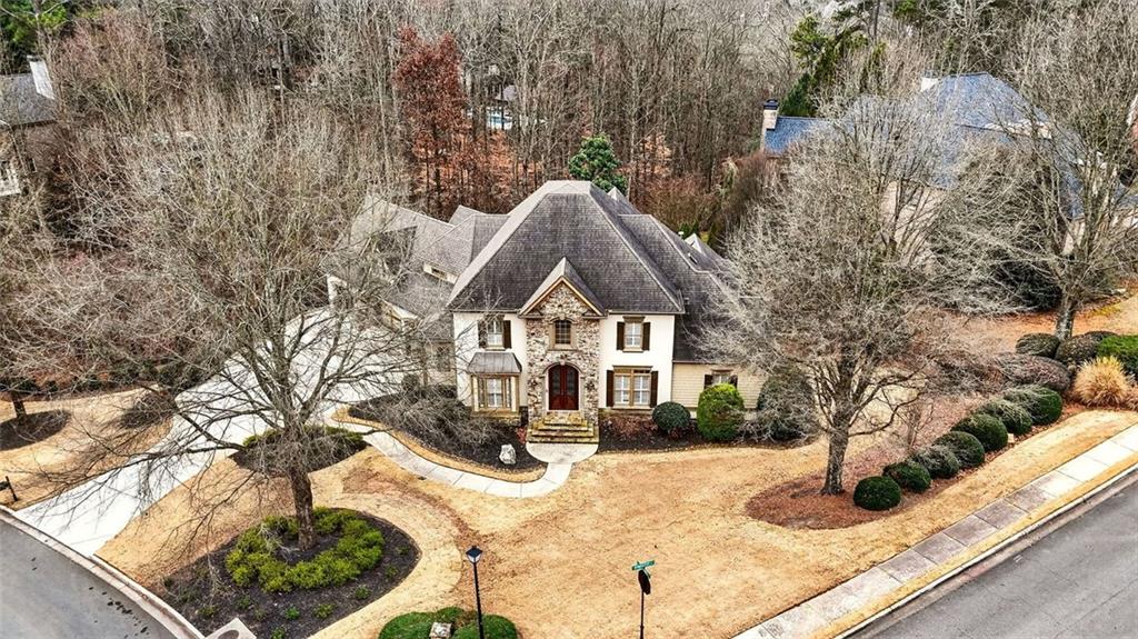 2910 Creek Tree Lane Cumming, GA 30041 - Photo 10 of 75 a front view of a house with a yard covered with snow