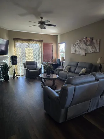 a living room with furniture and a large window