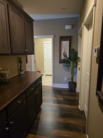 a kitchen with wooden cabinets and a sink
