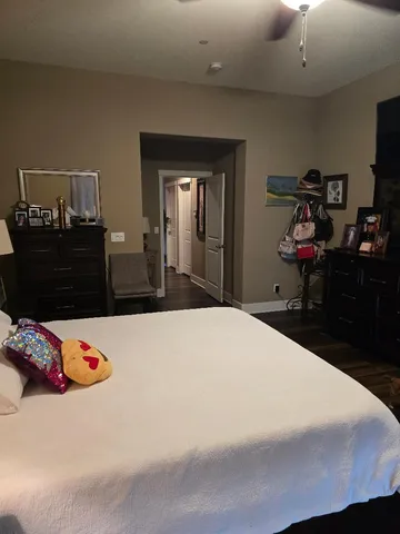 a bedroom with a bed and a dresser
