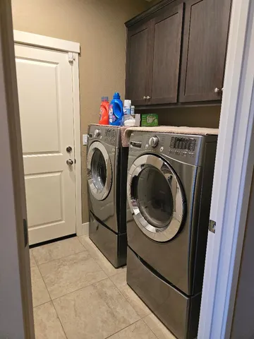 a utility room with dryer and washer