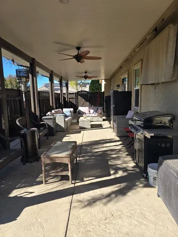 a view of a kitchen with stainless steel appliances granite countertop a stove and a refrigerator