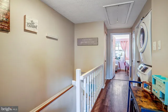 a view of an entryway with wooden floor