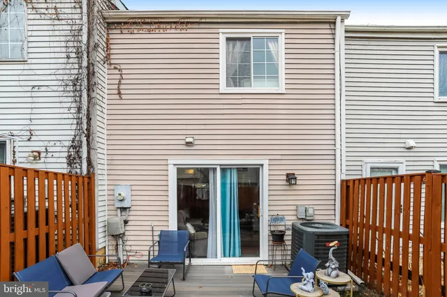 a backyard of a house with outdoor seating