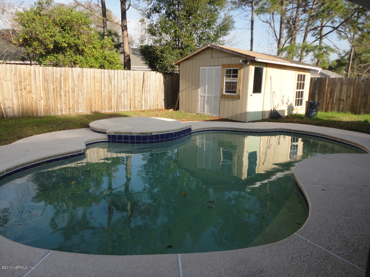 2441 Wattle Tree Road East Jacksonville, FL 32246 - Photo 11 of 13 a view of a house with backyard sitting area