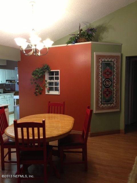 2441 Wattle Tree Road East Jacksonville, FL 32246 - Photo 7 of 13 a view of a chairs and table in a kitchen