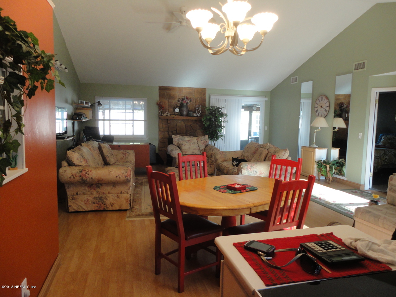 2441 Wattle Tree Road East Jacksonville, FL 32246 - Photo 8 of 13 a view of a dining room with furniture and chandelier