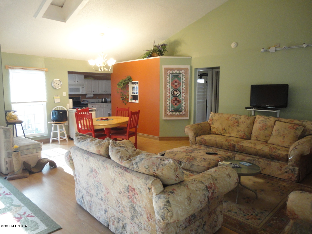 2441 Wattle Tree Road East Jacksonville, FL 32246 - Photo 9 of 13 a living room with furniture and a flat screen tv