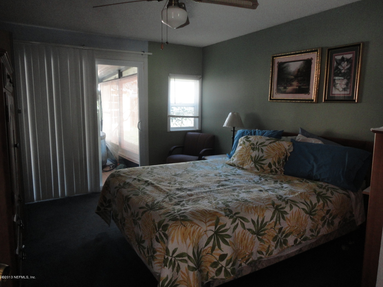2441 Wattle Tree Road East Jacksonville, FL 32246 - Photo 10 of 13 a bed sitting in a bedroom next to a window