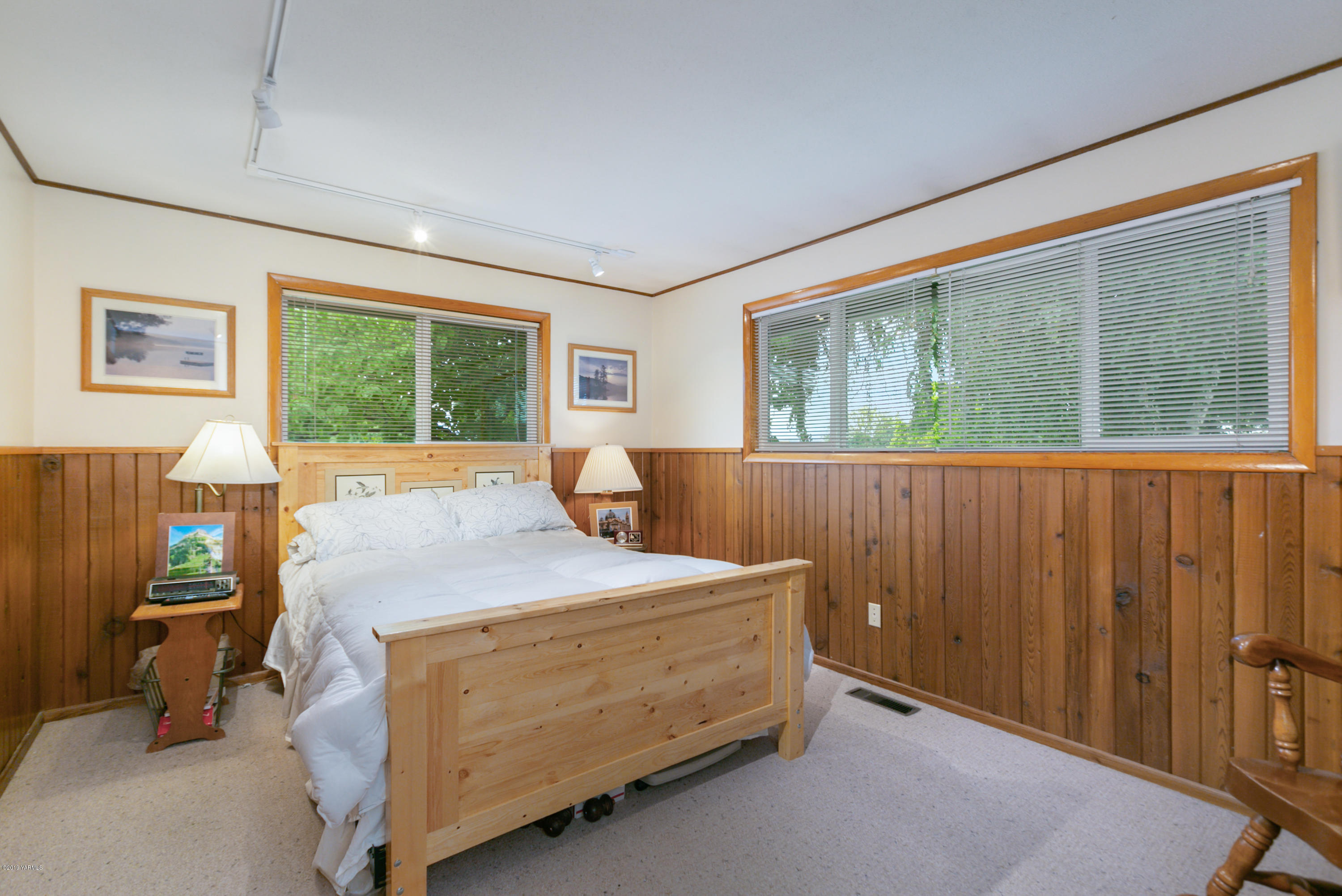 1608 Ahtanum Road Union Gap, WA 98903 - Photo 12 of 18 a bed sitting in a bedroom next to a window