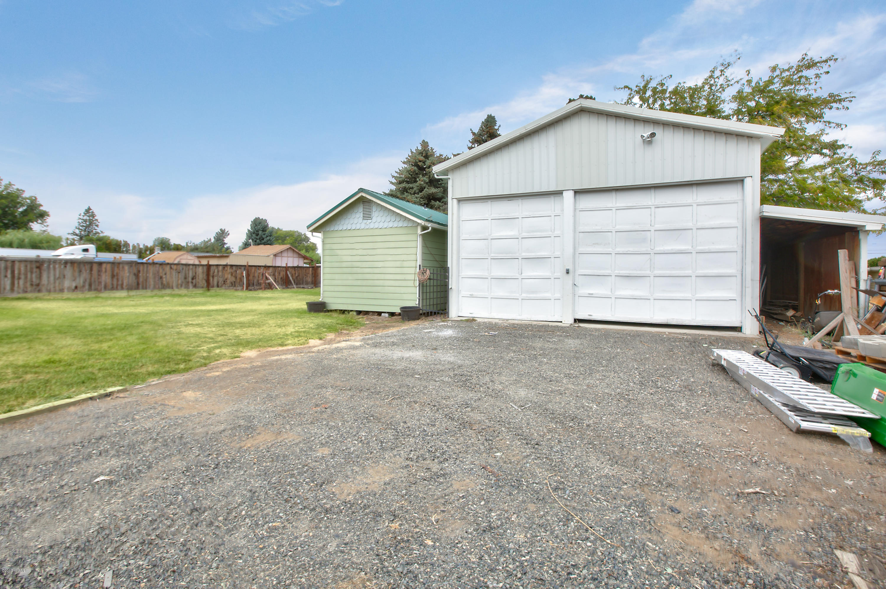 1608 Ahtanum Road Union Gap, WA 98903 - Photo 15 of 18 a view of a house with a yard and garage