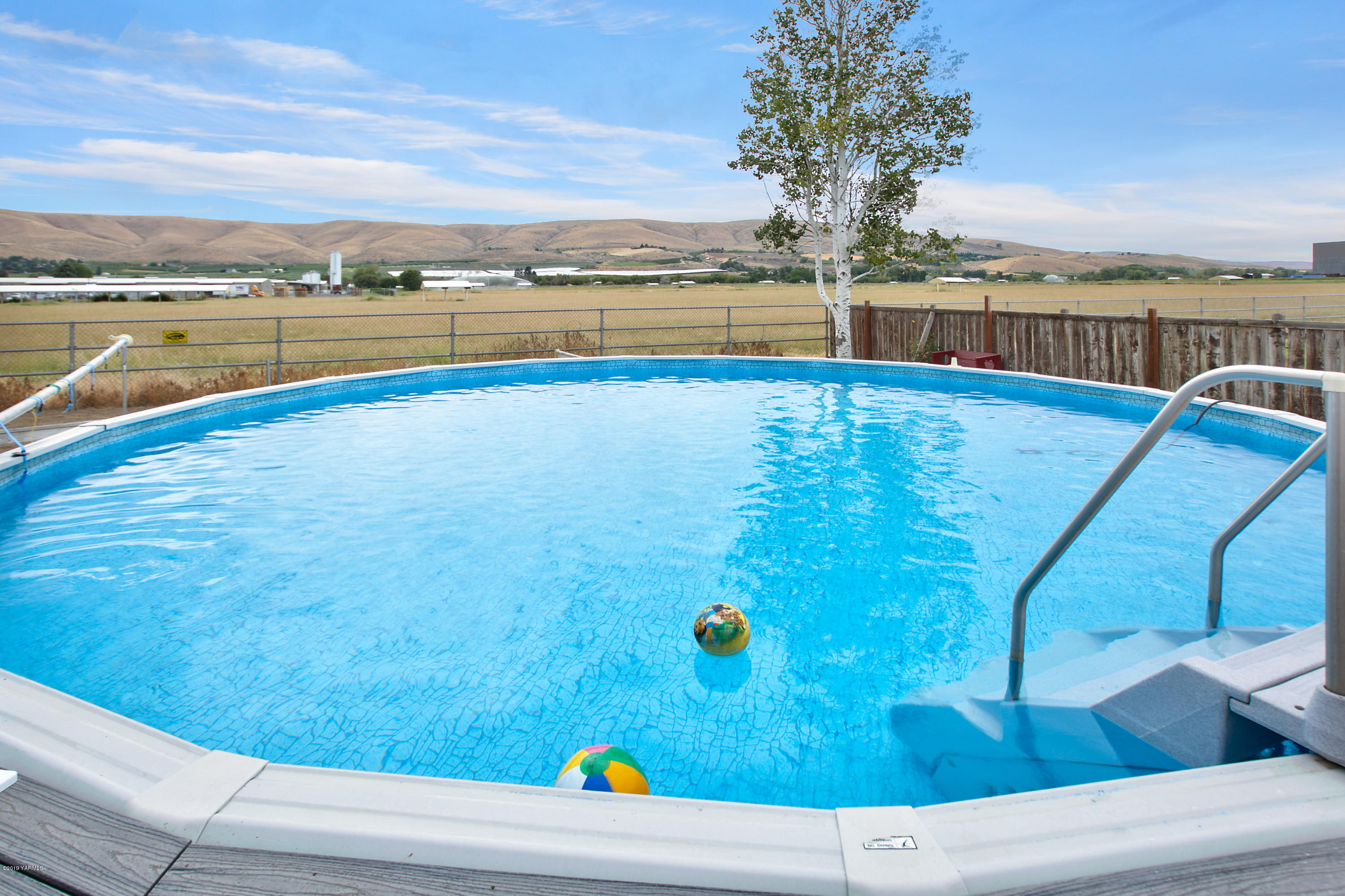 1608 Ahtanum Road Union Gap, WA 98903 - Photo 16 of 18 a view of swimming pool with an ocean view