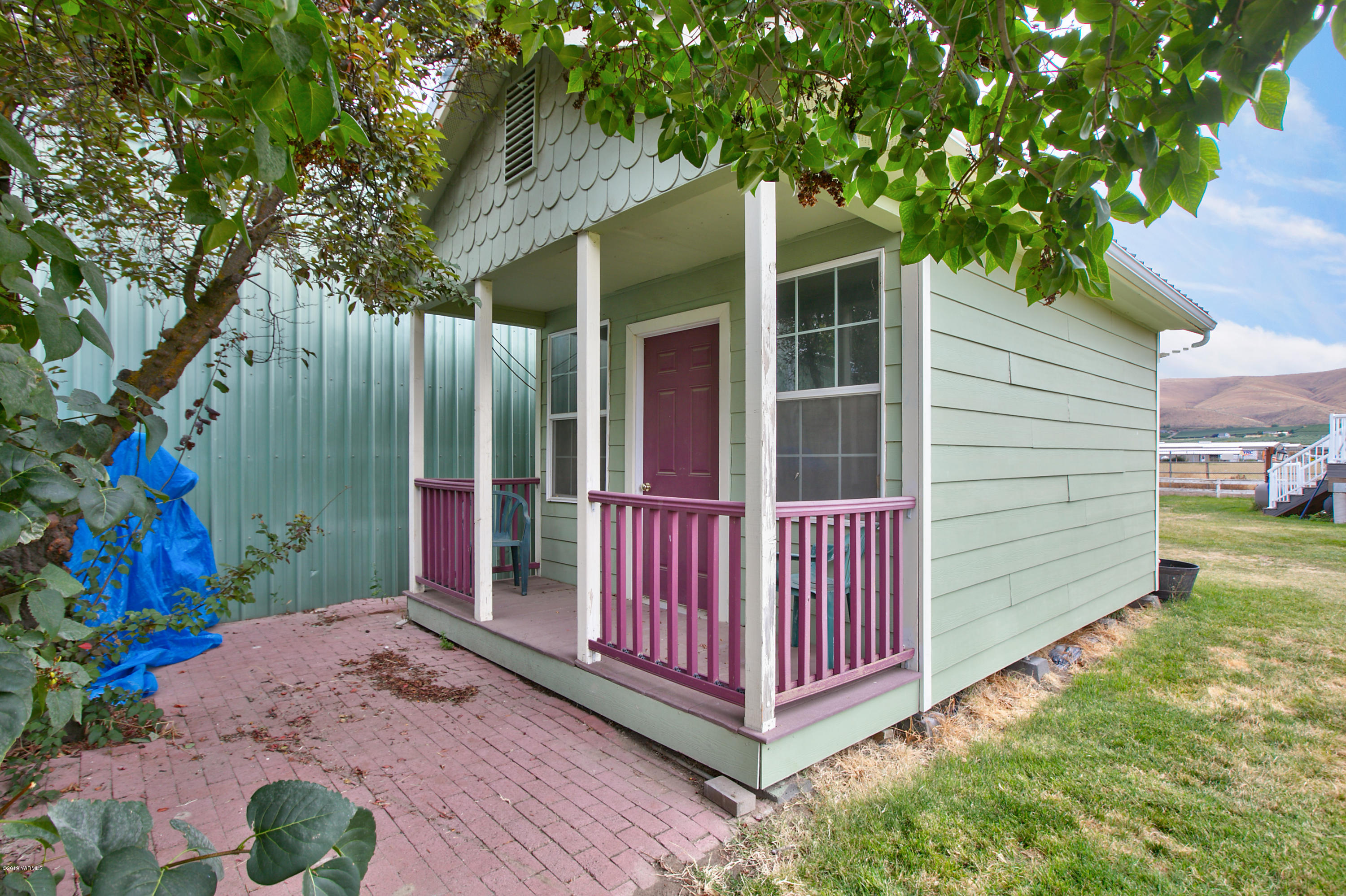 1608 Ahtanum Road Union Gap, WA 98903 - Photo 17 of 18 a view of a small house with a yard