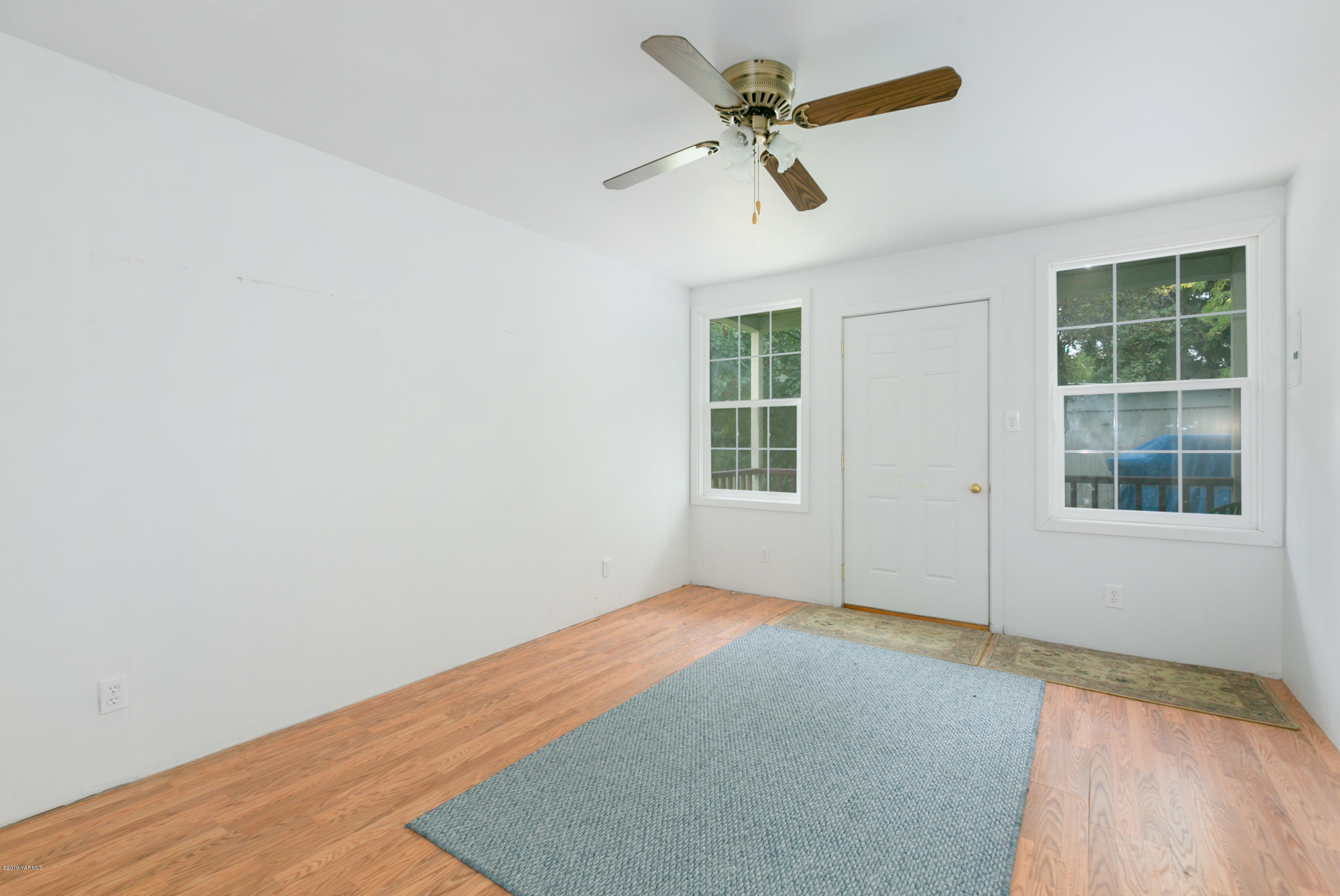 1608 Ahtanum Road Union Gap, WA 98903 - Photo 18 of 18 a view of empty room with wooden floor and fan