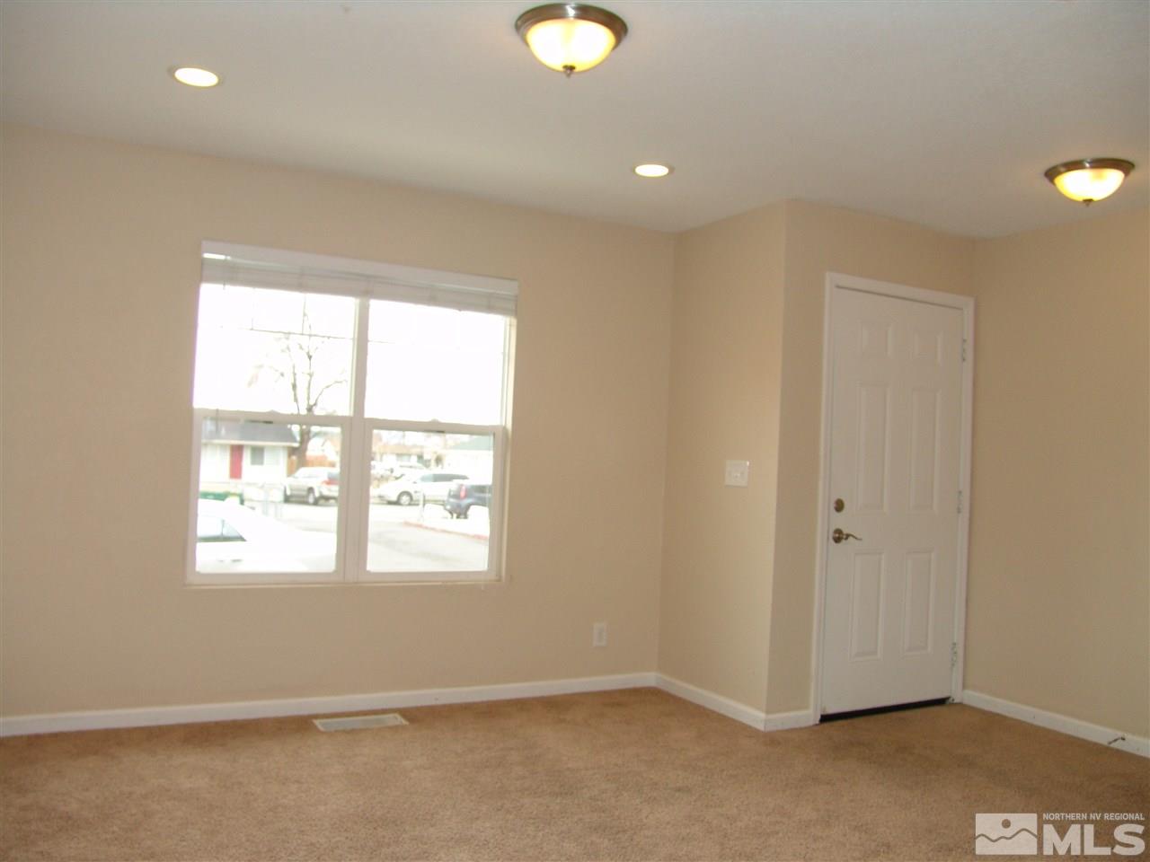 795 Montello Street Reno, NV 89512 - Photo 2 of 13 a view of an empty room with a window