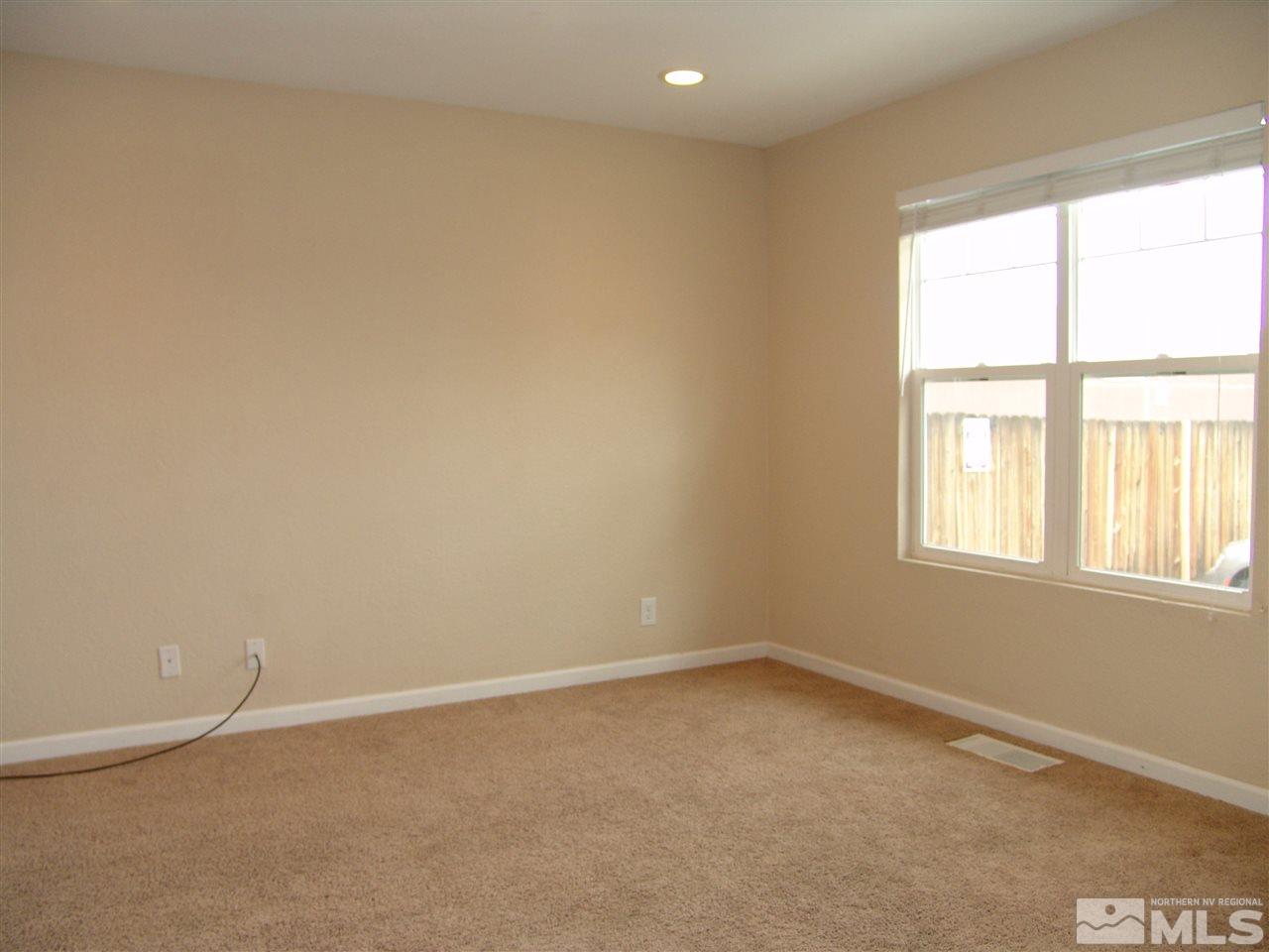 795 Montello Street Reno, NV 89512 - Photo 3 of 13 an empty room with a window