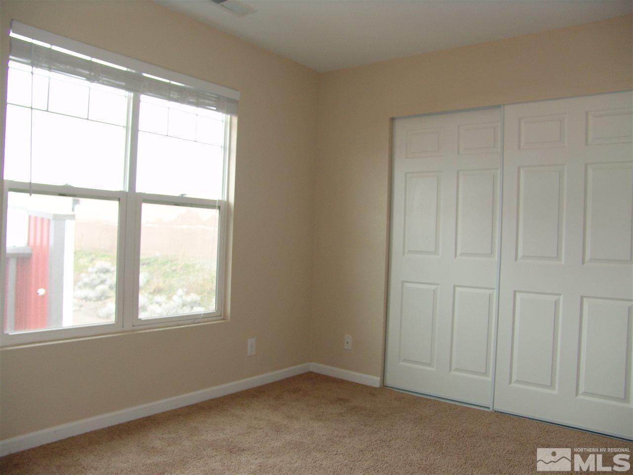 795 Montello Street Reno, NV 89512 - Photo 9 of 13 an empty room with windows