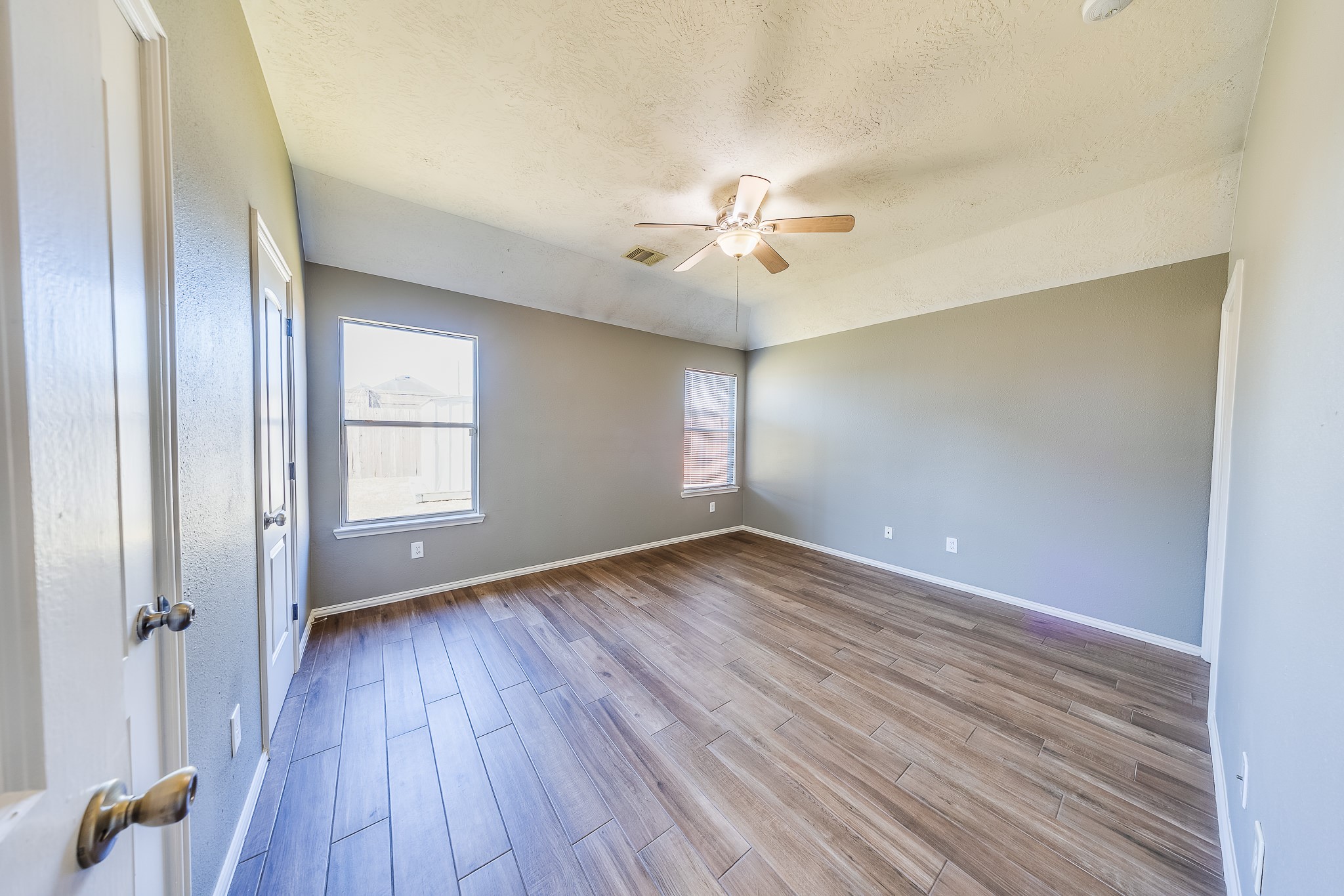 21927 Octavia Way Houston, TX 77073 - Photo 16 of 28 Spacious primary bedroom with abundant natural light, cozy atmosphere, and ample space for relaxation and personal retreat.