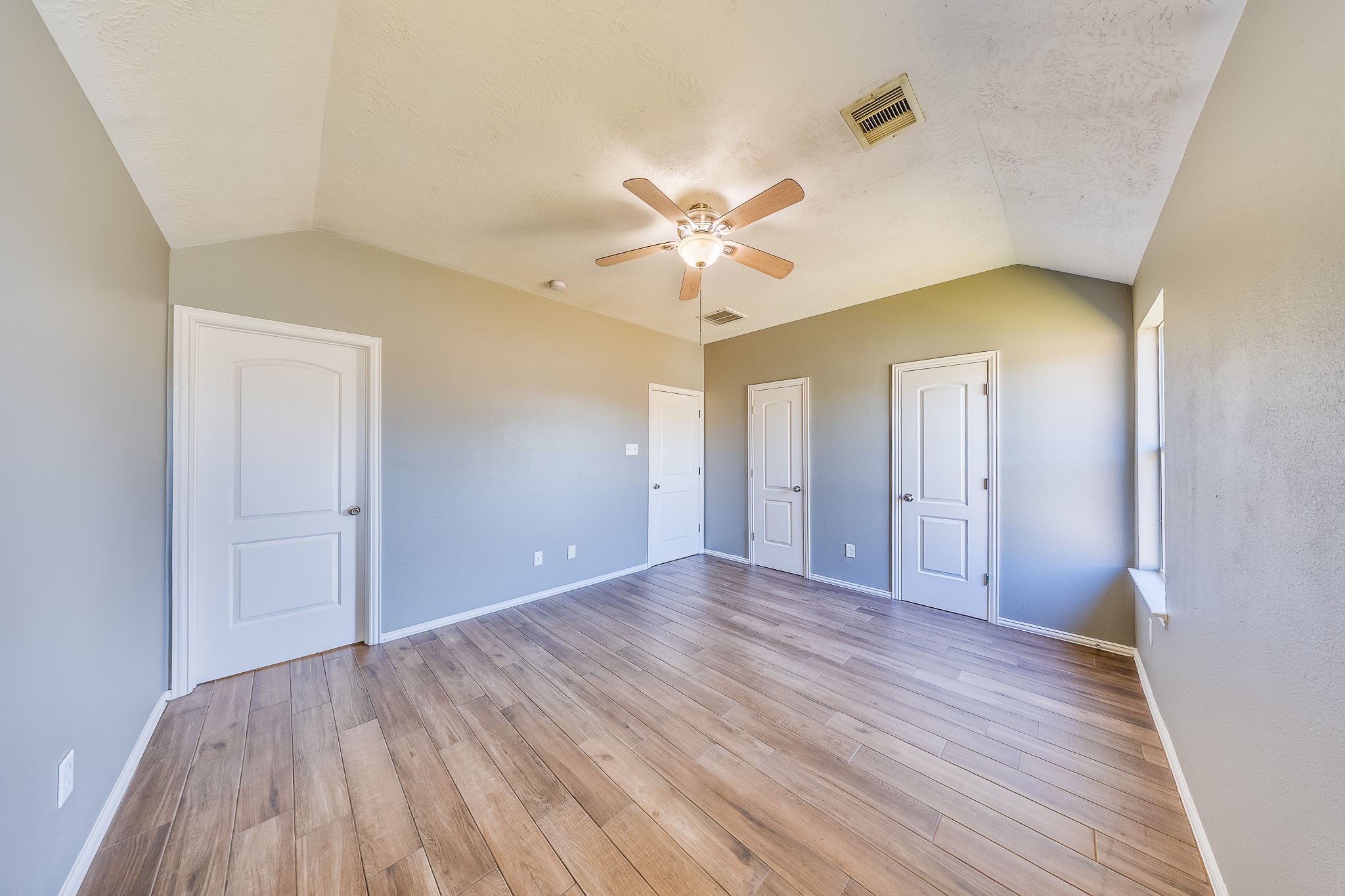21927 Octavia Way Houston, TX 77073 - Photo 17 of 28 Primary bedroom featuring generous space, bright windows, and a serene environment perfect for comfort and restful nights.