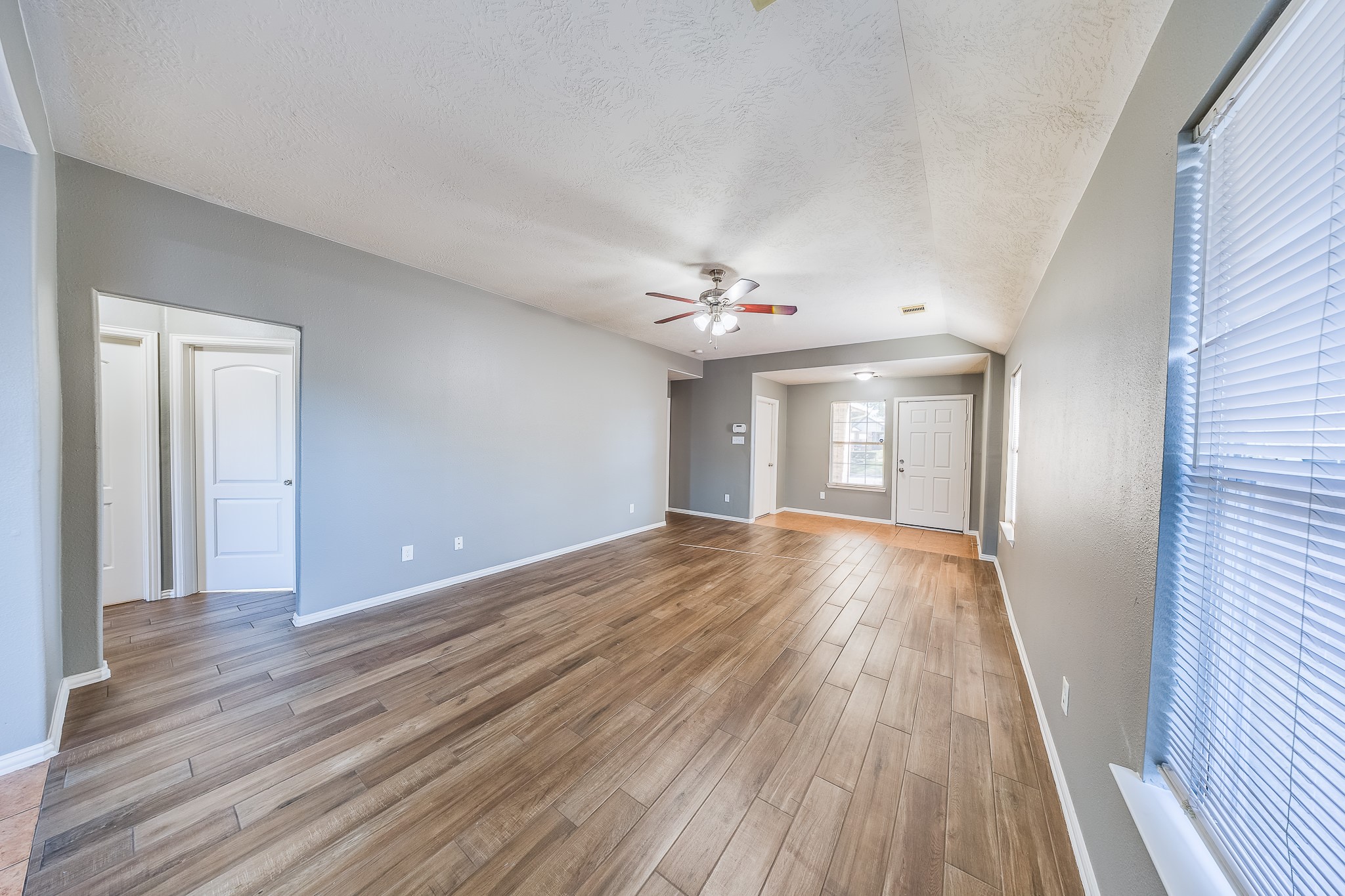 21927 Octavia Way Houston, TX 77073 - Photo 2 of 28 Spacious living room with open layout, abundant natural light, and flexible space perfect for relaxing or entertaining guests comfortably.
