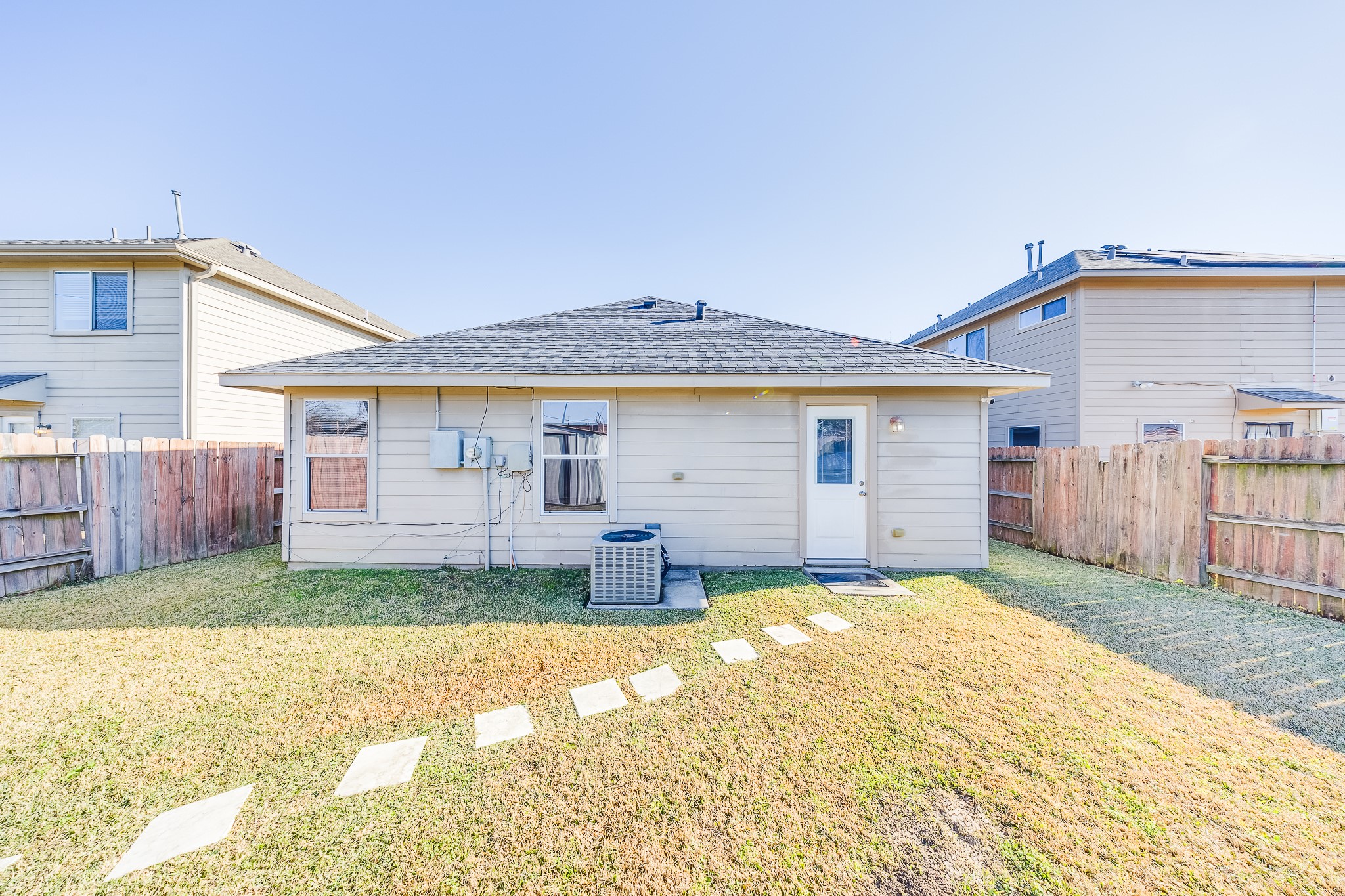 21927 Octavia Way Houston, TX 77073 - Photo 26 of 28 Patio-ready backyard offering an ideal space for entertaining, barbecues, or enjoying sunny days outdoors.