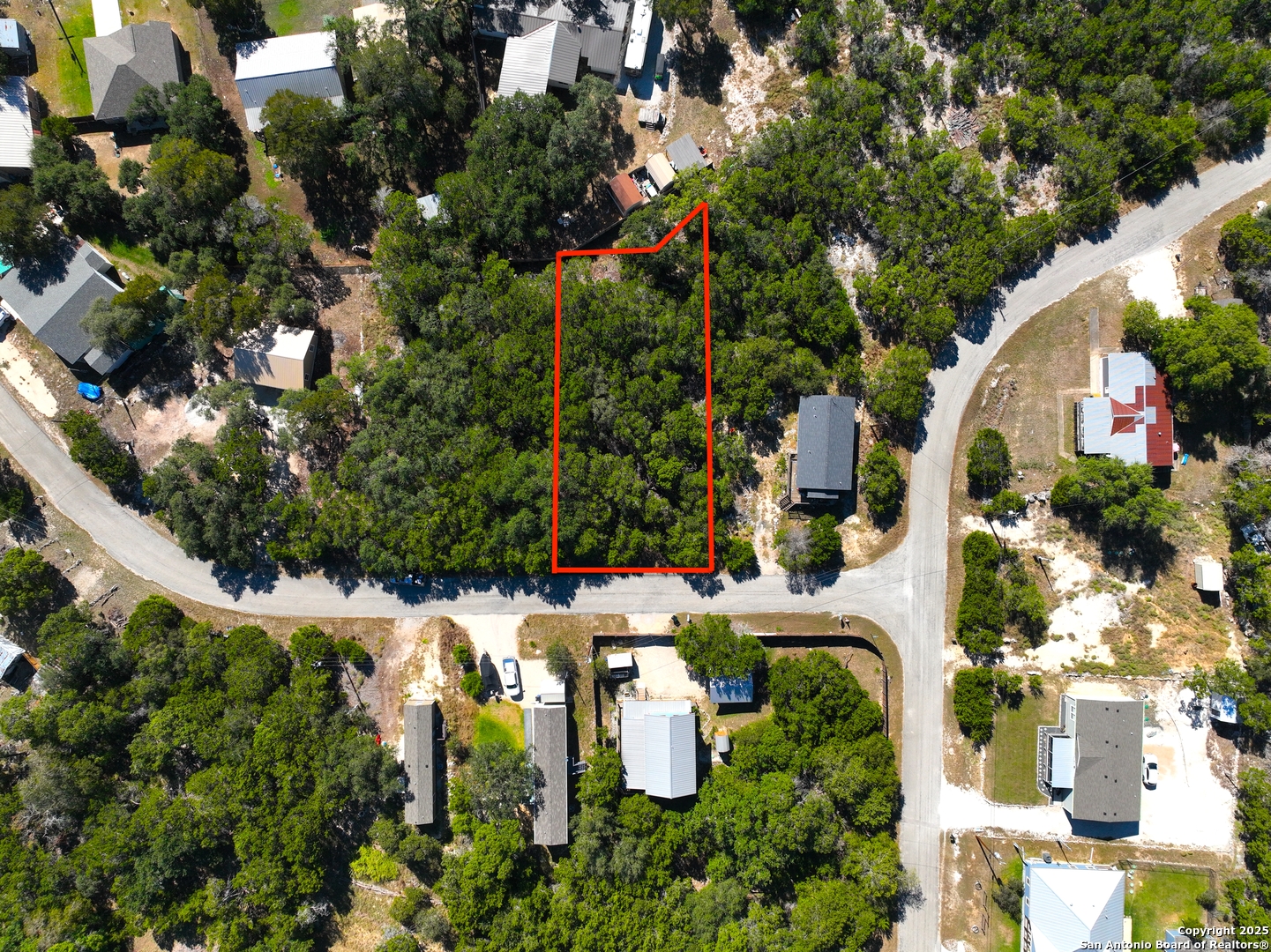 426 Clay Ridge Canyon Lake, TX 78133 - Photo 1 of 8 an aerial view of multiple houses with yard