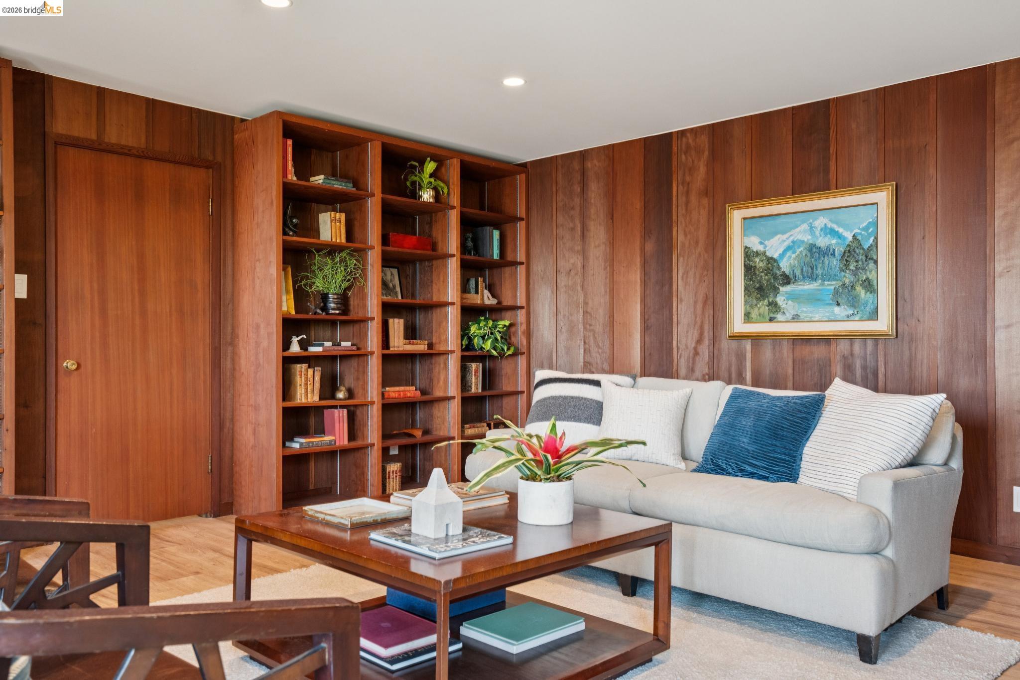 38 Highgate Road Kensington, CA 94707 - Photo 42 of 78 Integrated wood-paneled walls, built-in shelving, recessed ceiling lighting, and wood-finish flooring