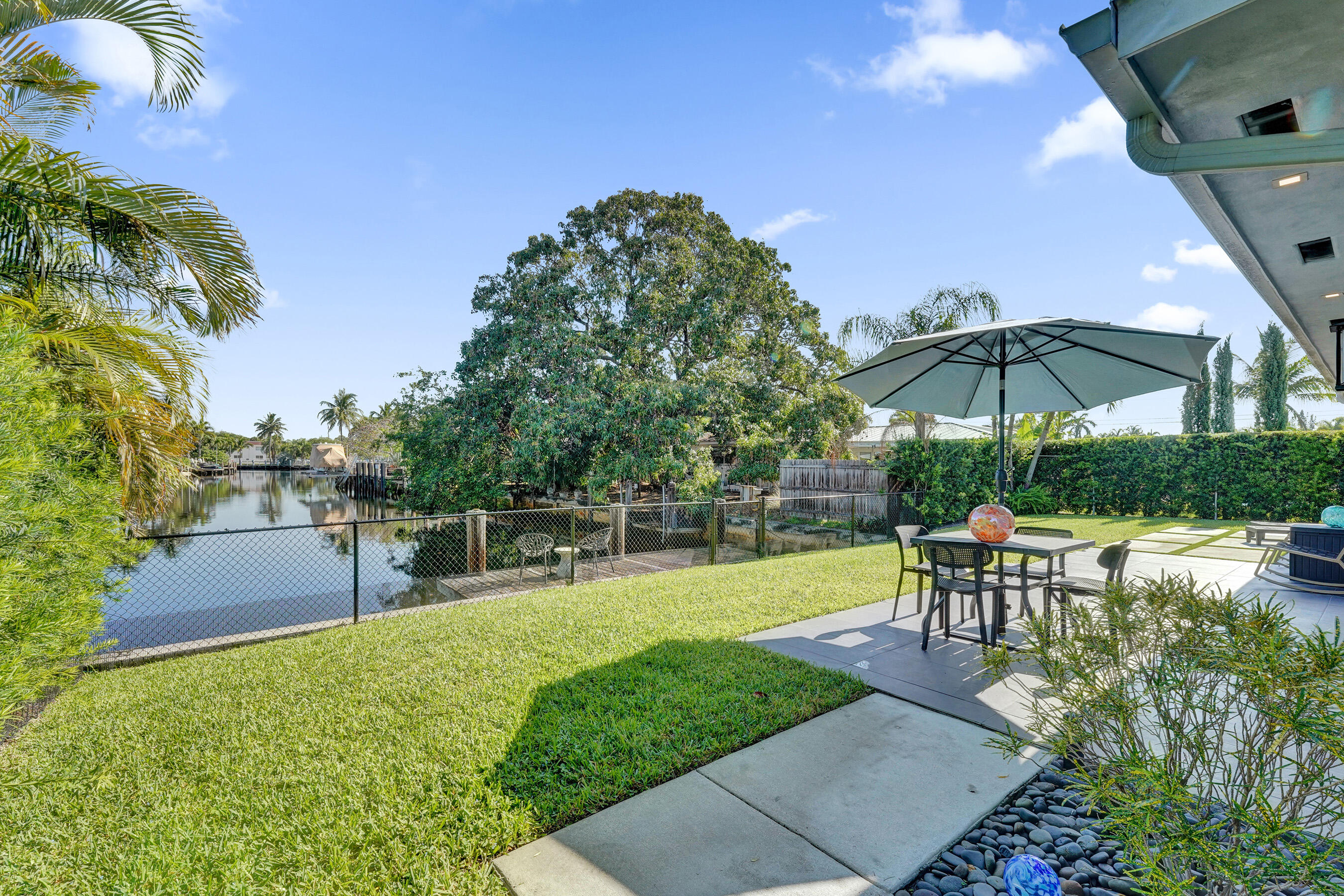 381 Southeast 3rd Street Pompano Beach, FL 33060 - Photo 24 of 41 a garden view with a seating space