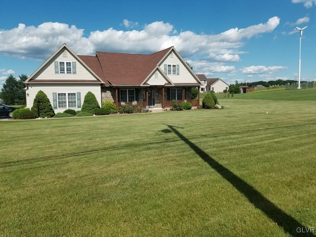 1032 Bushkill Center Road Wind Gap, PA 18091 - Photo 1 of 47 a front view of a house with a garden