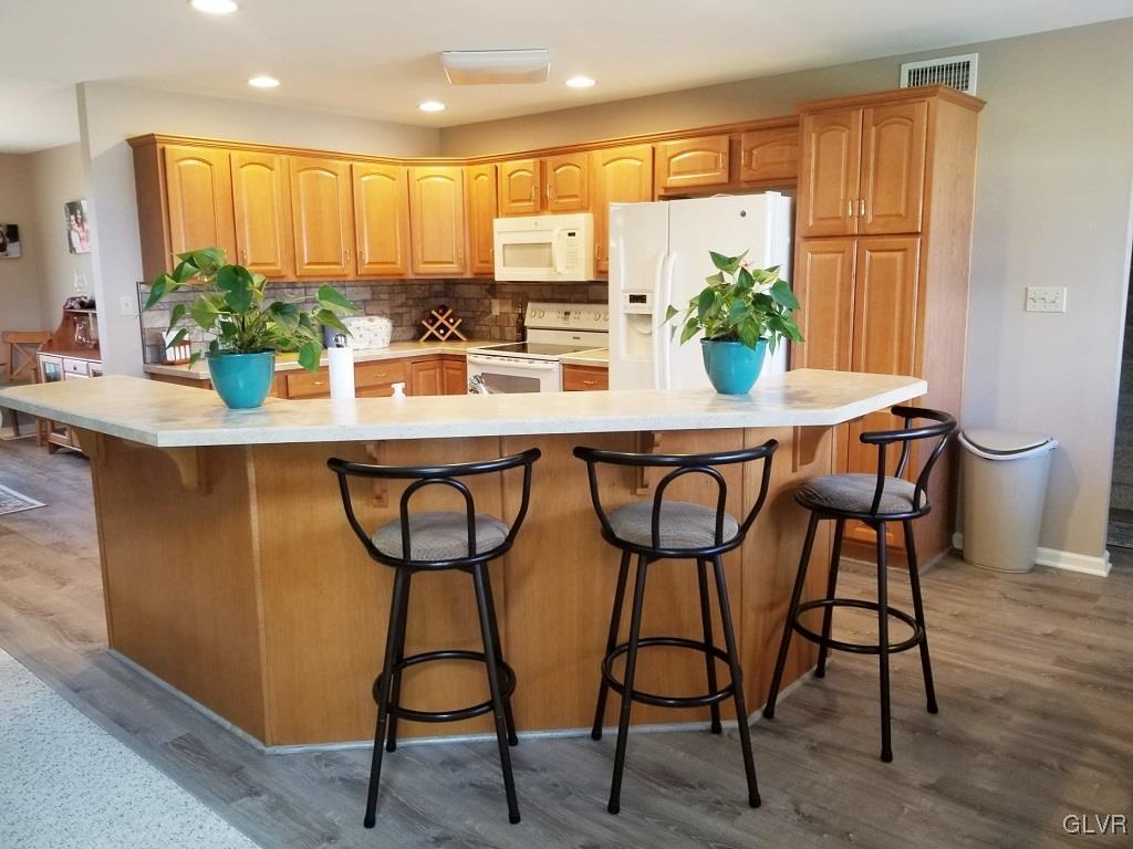1032 Bushkill Center Road Wind Gap, PA 18091 - Photo 20 of 47 a kitchen with stainless steel appliances kitchen island granite countertop furniture cabinets and a potted plant