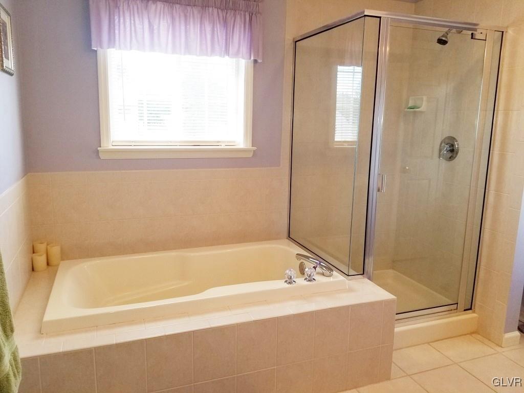 1032 Bushkill Center Road Wind Gap, PA 18091 - Photo 28 of 47 a white bath tub sitting next to a shower