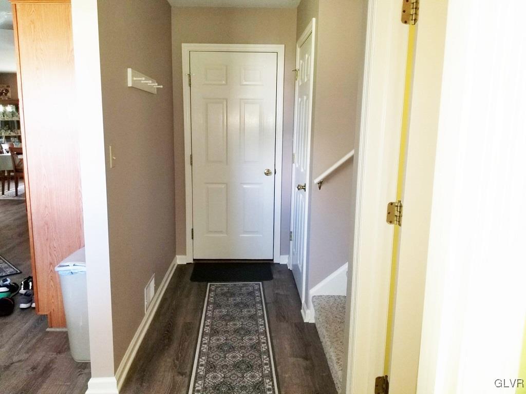 1032 Bushkill Center Road Wind Gap, PA 18091 - Photo 39 of 47 a view of a hallway with wooden floor and a bathroom