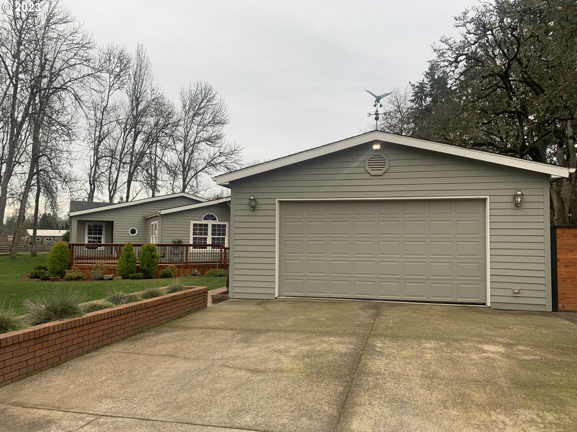 36934 Wheeler Road Pleasant Hill, OR 97455 - Photo 15 of 31 a front view of a house with a yard and garage