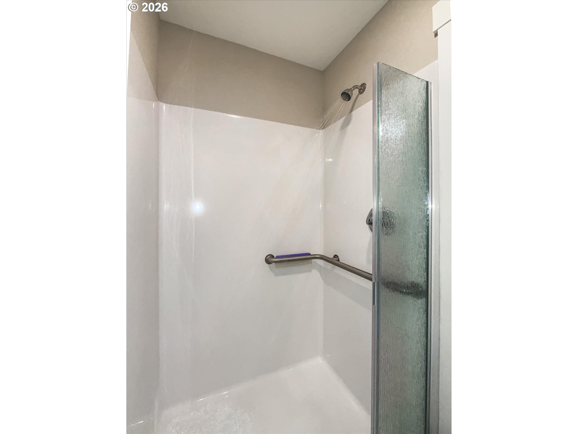 161 Combs Circle Yachats, OR 97498 - Photo 20 of 48 a bathroom with a glass shower door