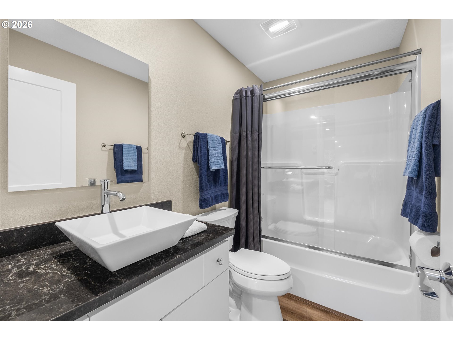 161 Combs Circle Yachats, OR 97498 - Photo 31 of 48 a bathroom with a sink a toilet and a mirror