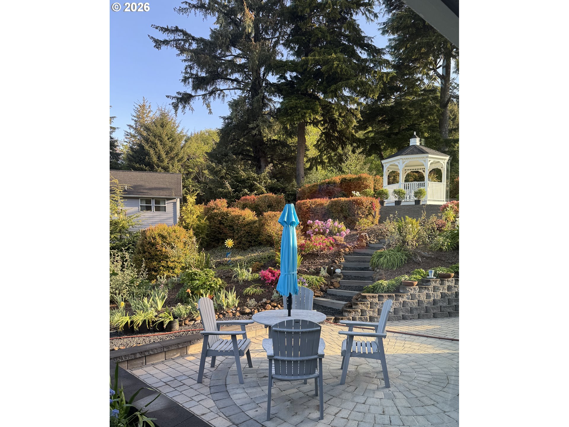 161 Combs Circle Yachats, OR 97498 - Photo 42 of 48 a view of a patio with table and chairs and potted plants