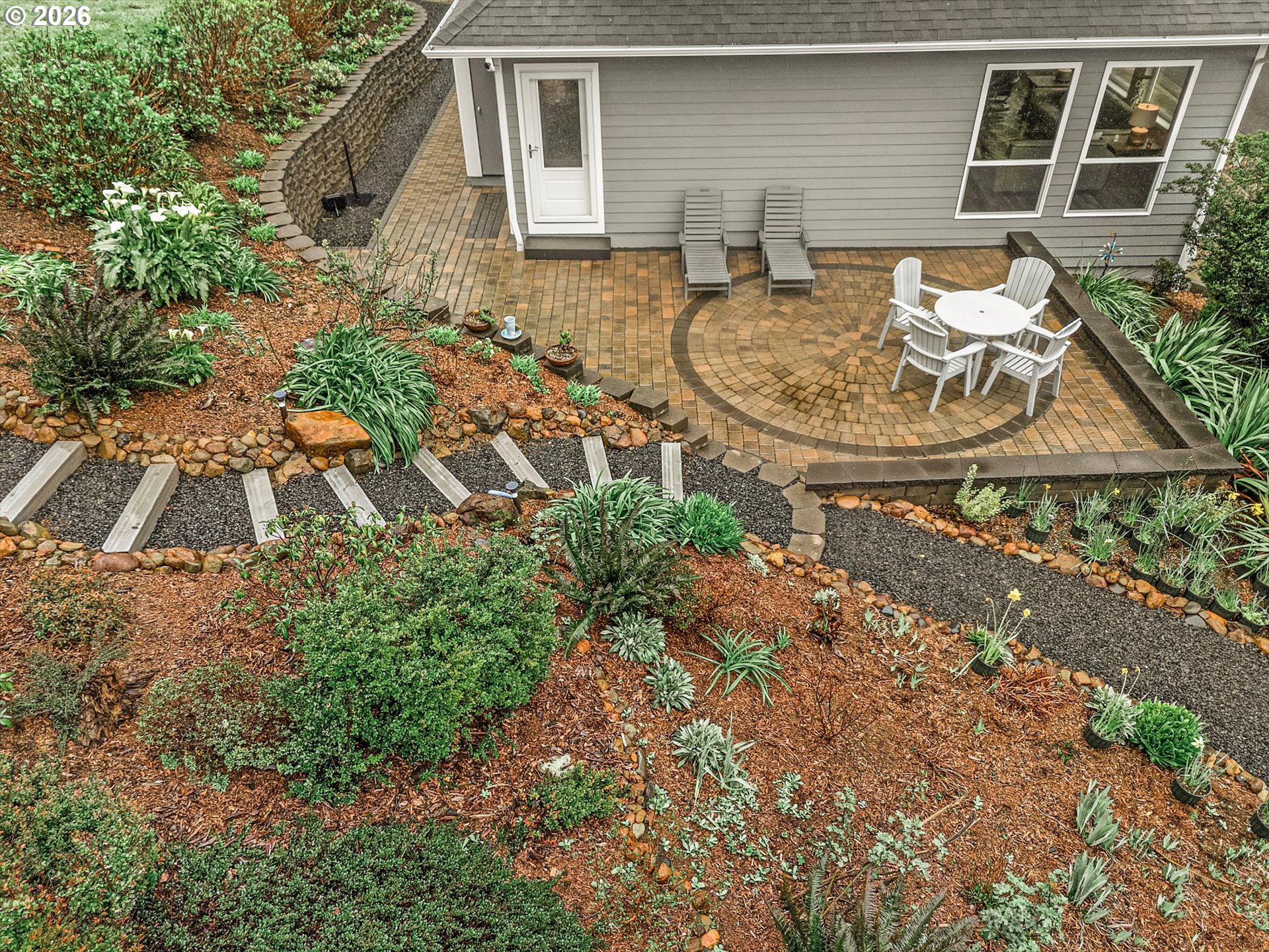 161 Combs Circle Yachats, OR 97498 - Photo 5 of 48 a backyard of a house with table and chairs